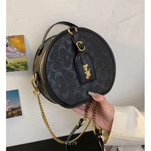 Signature Round Sling Bag